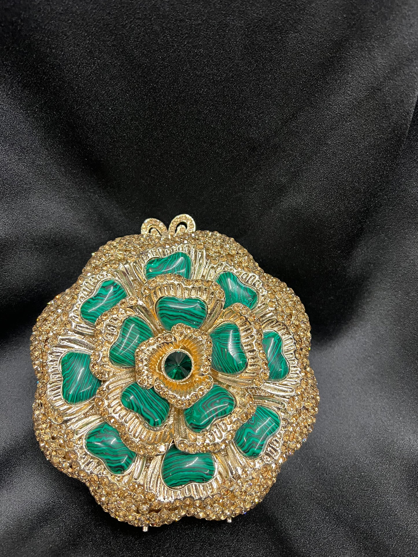 Green and gold clutch